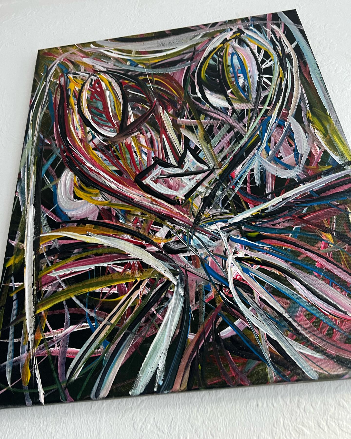 Abstract painting with multicolored brush strokes on a white background