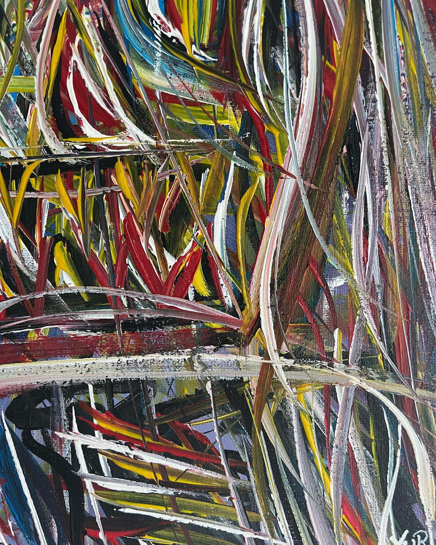 Abstract artwork with multicolored brush strokes on a textured surface