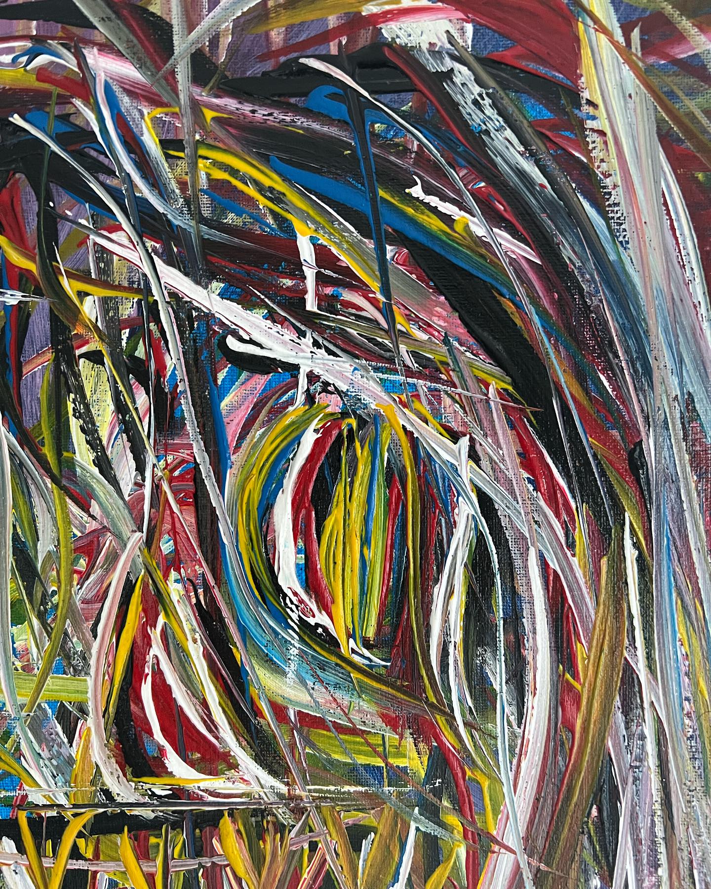 Abstract painting with swirling colors on a black background