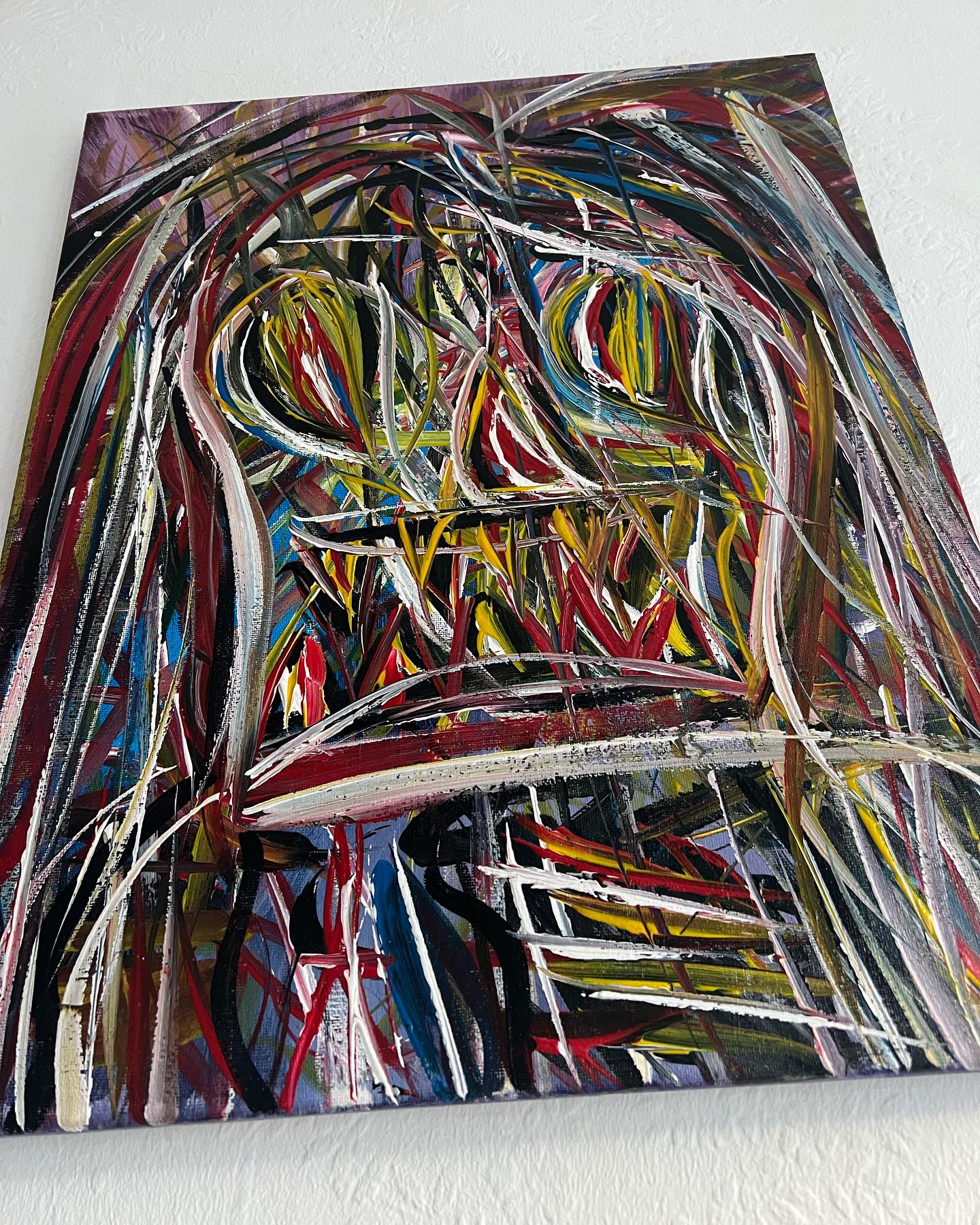 Abstract painting with multicolored brush strokes on a white background