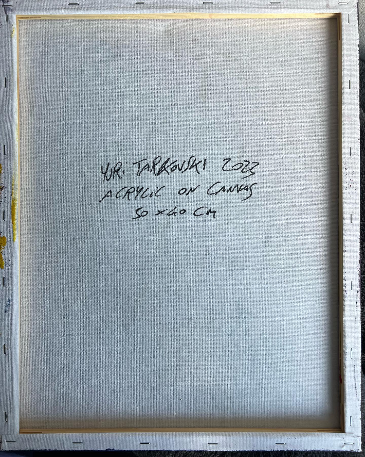 Back of a painting with artist's signature and dimensions