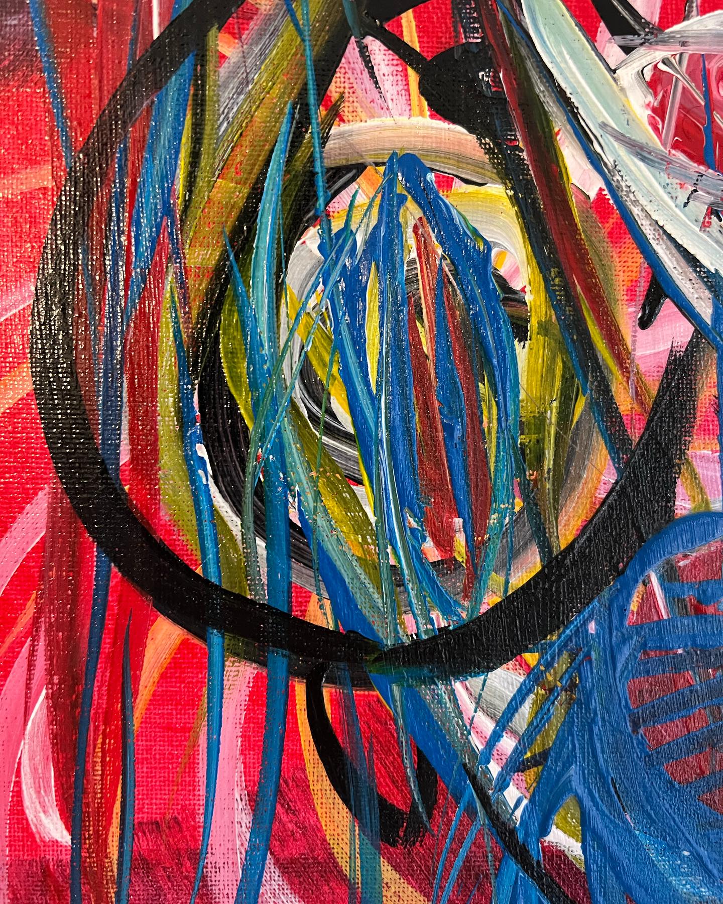 Abstract painting with swirling colors on a red background