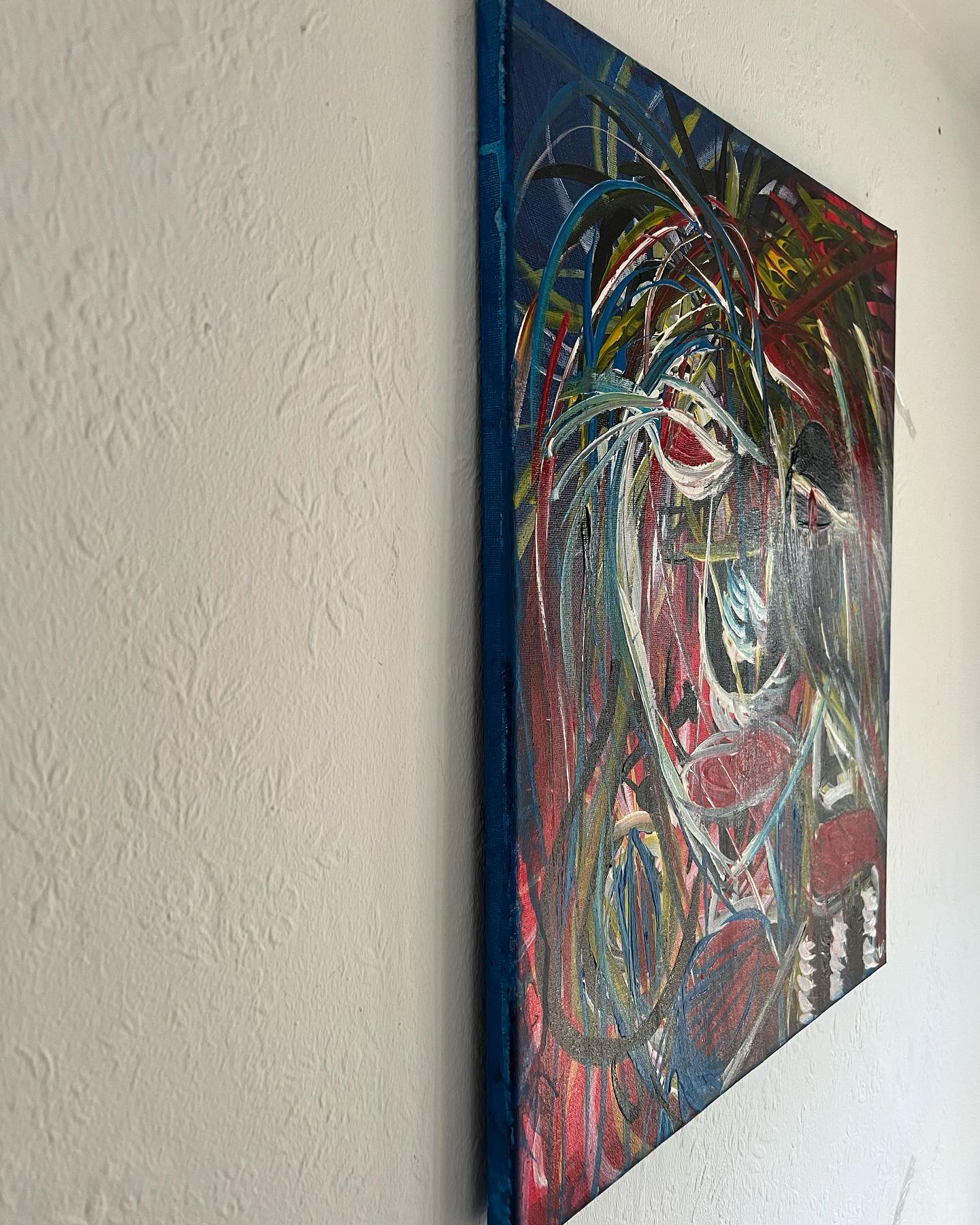 Abstract painting of a horse on a textured wall