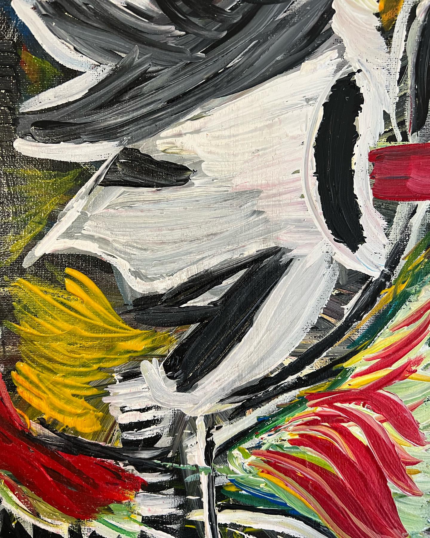 Abstract painting with bold strokes of black, white, red, yellow, and green.