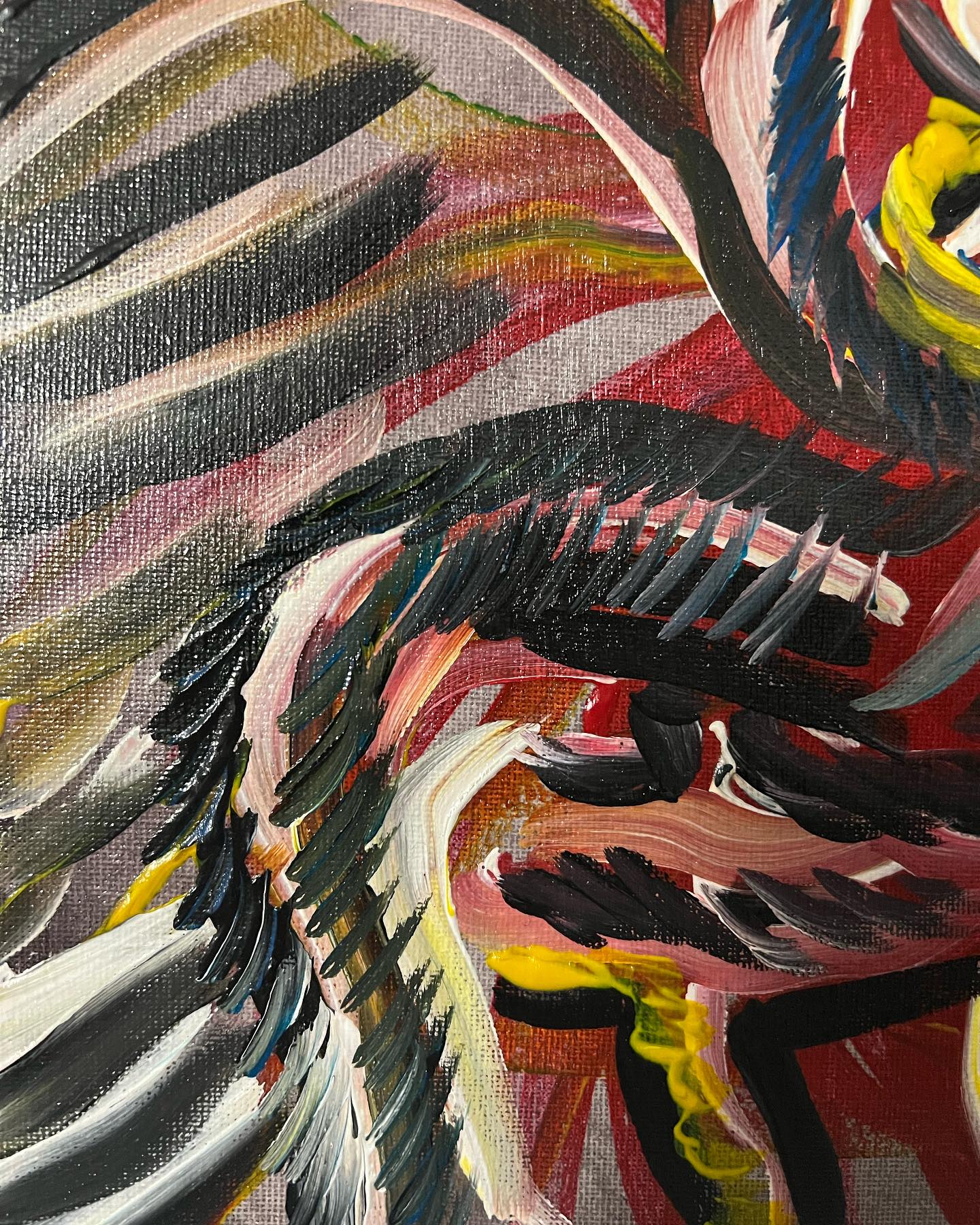 Abstract artwork with colorful brush strokes on a textured surface