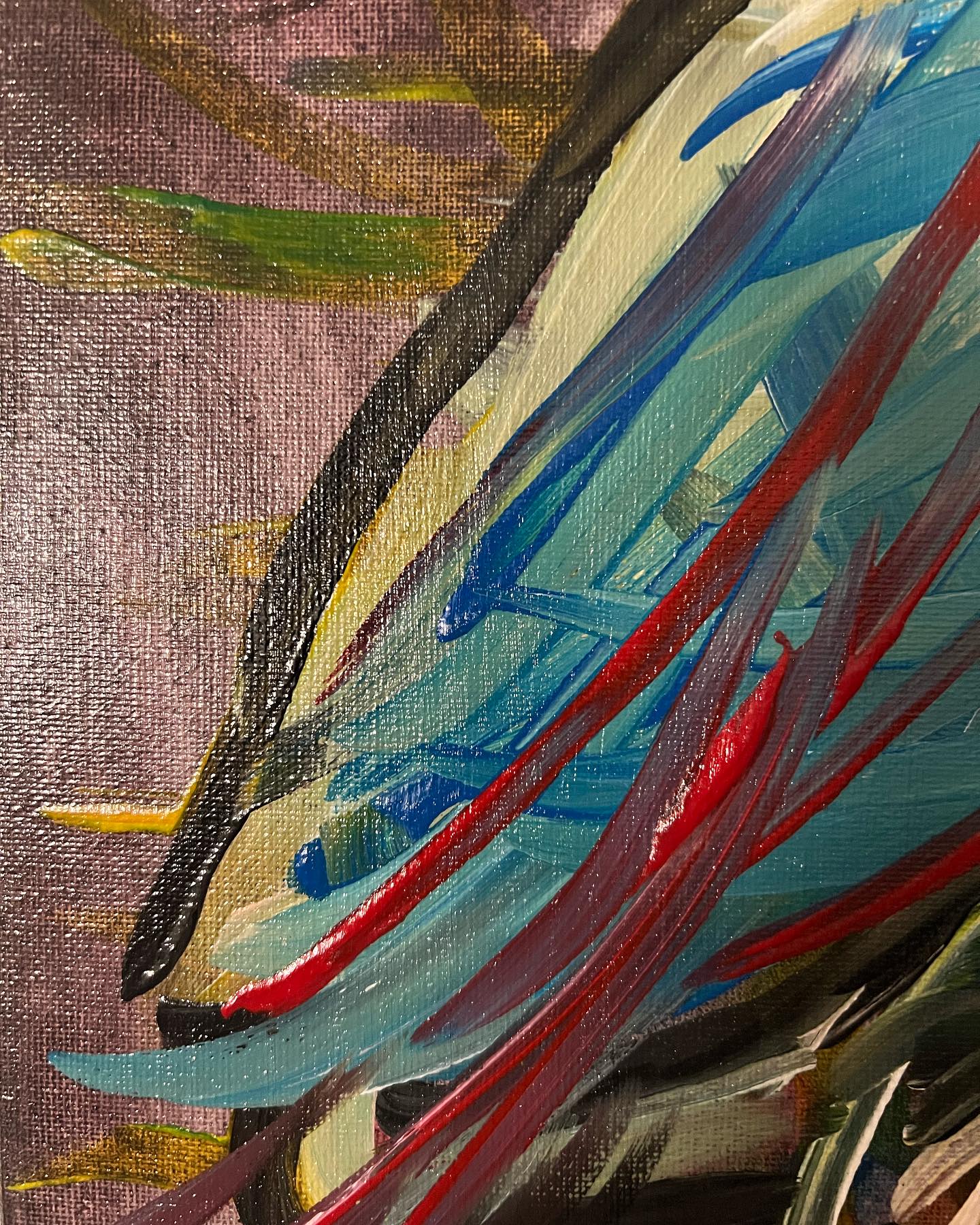 Abstract painting with bold brush strokes in red, blue, and yellow on a textured background